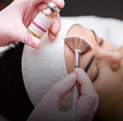 Aesthetician applying a chemical peel facial treatment on client skin in Yuma, AZ | Amara Rejuve Medical Spa & Laser