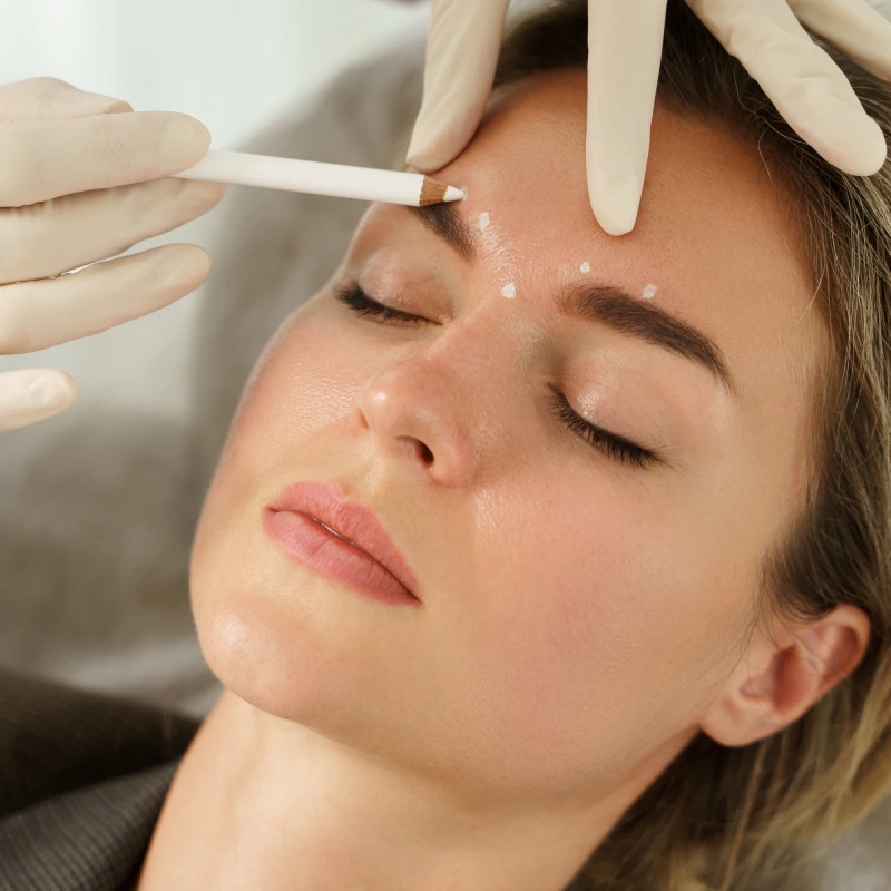 Client receiving dermal filler treatment for lip and cheek volume enhancement in Yuma, AZ | Amara Rejuve Medical Spa & Laser