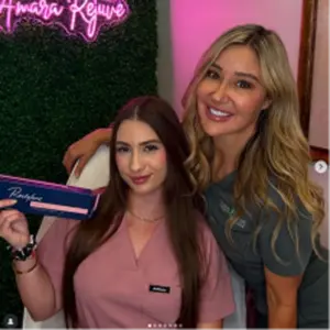 Two women smiling at neon spa sign during a medical spa visit in Yuma, AZ | Amara Rejuve Medical Spa & Laser