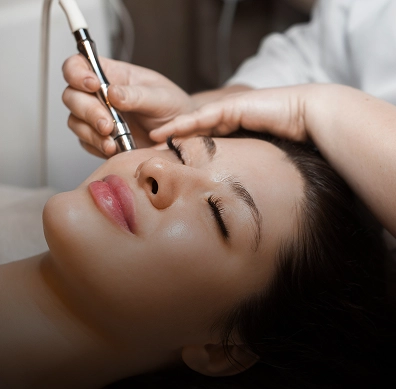 Aesthetician performing microneedling treatment on client face in Yuma, AZ | Amara Rejuve Medical Spa & Laser